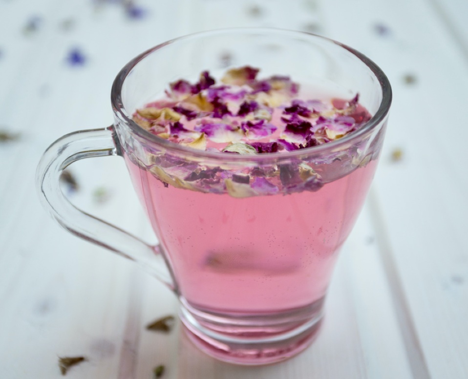 beautiful pink herbal tea in a glass mug - NIIJI's Earthly Science Solutions